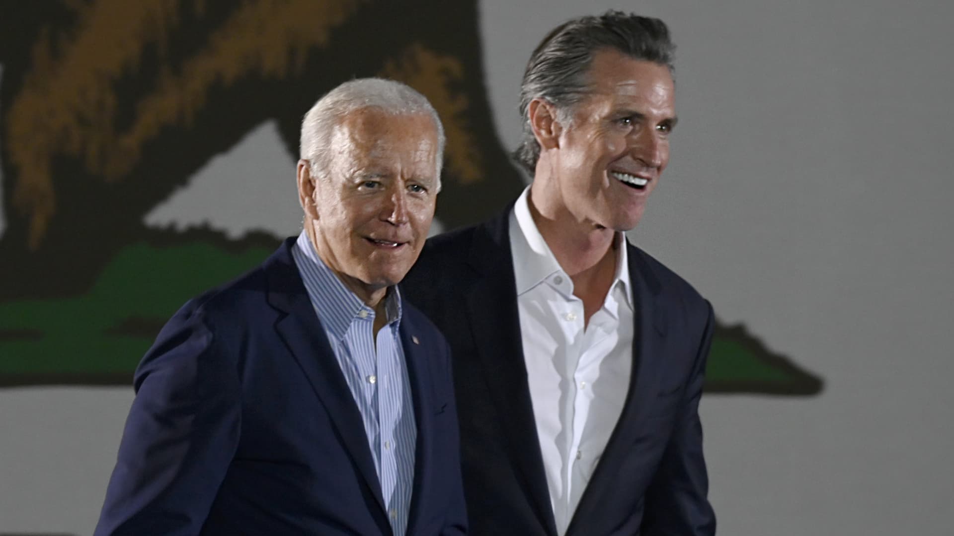 President Joe Biden and Governor Gavin Newsom enter the stage at Long Beach City College on the final day of campaigning against the recall in Long Beach on Sunday, August 1, 2021.
