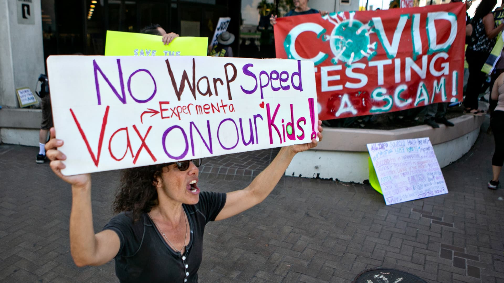 Demonstrators opposed to masking and mandatory vaccination for students gather outside the Los Angeles Unified School District headquarters as board members voted that all children 12 and older in Los Angeles public schools must be fully vaccinated against COVID-19 by January to enter campus on Thursday, Sept. 9, 2021 in Los Angeles, CA.