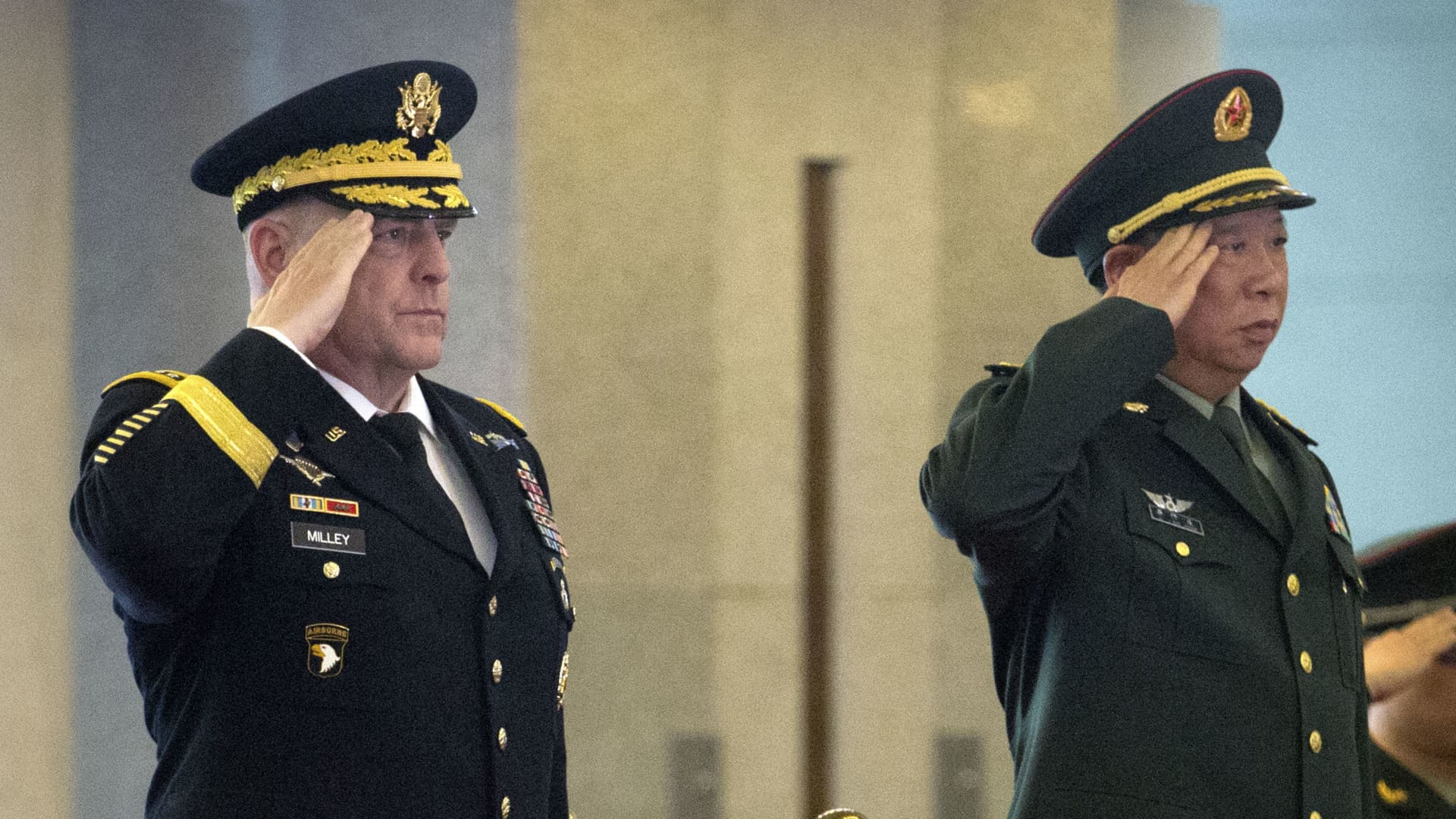 US Army Chief of Staff General Mark Milley (L) and China's People's Liberation Army (PLA) General Li Zuocheng salute during a welcome ceremony at the Bayi Building in Beijing on August 16, 2016.