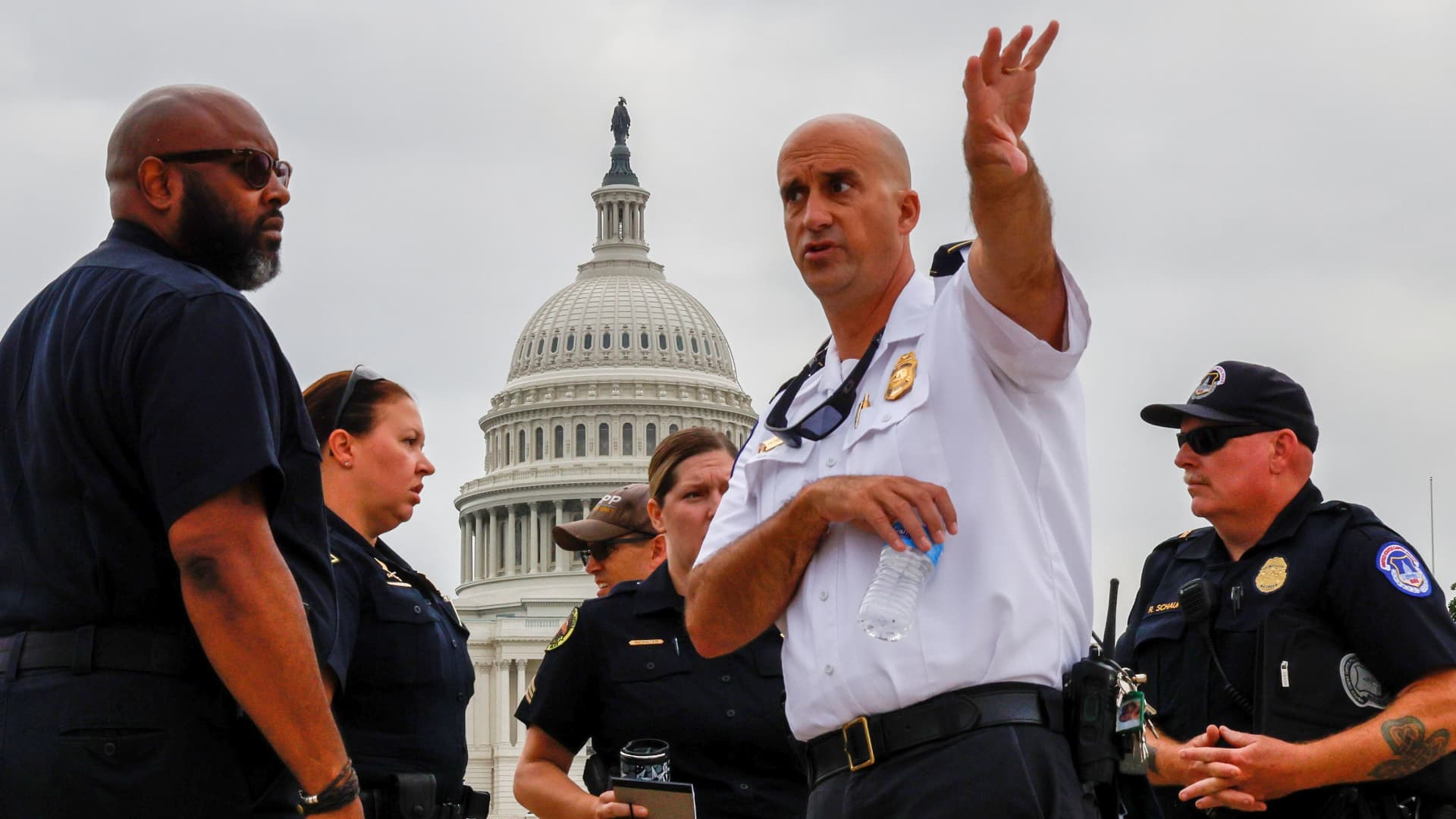 U.S. Capitol Police officials survey the area around the Capitol reflecting pool ahead of an expected rally Saturday in support of the Jan. 6 defendants in Washington, U.S. September 16, 2021.