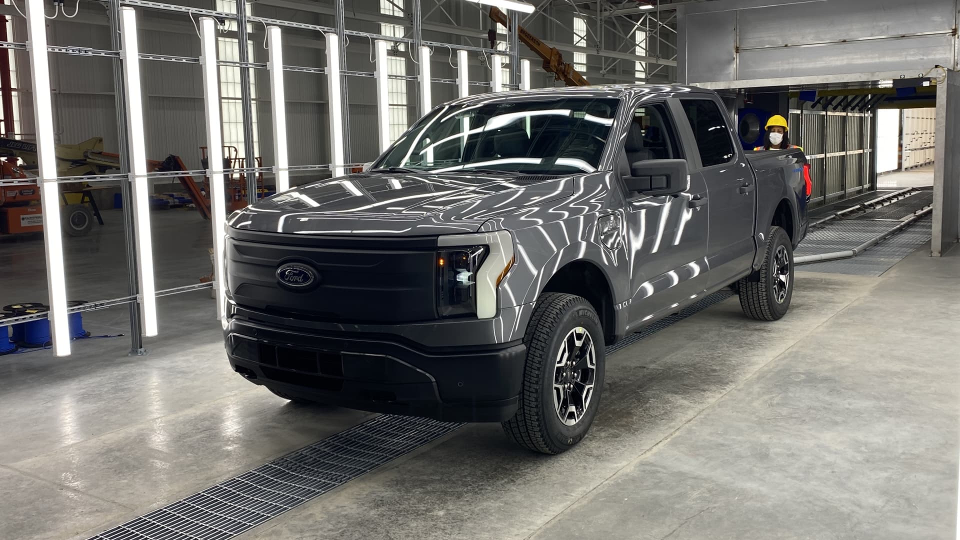 Ford has started initial pre-production of its electric F-150 Lightning pickup truck at a new plant in Dearborn, Mich.