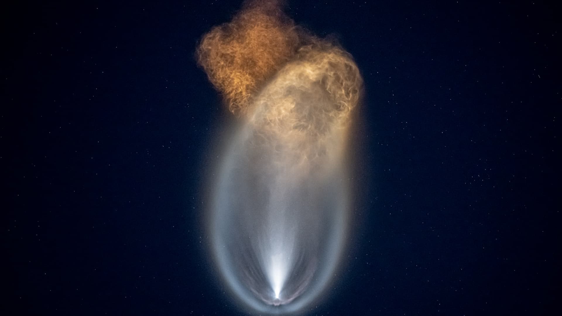 The shimmering exhaust plume of SpaceX's Falcon 9 rocket launching into the dusk sky above Florida on September 15, 2021.