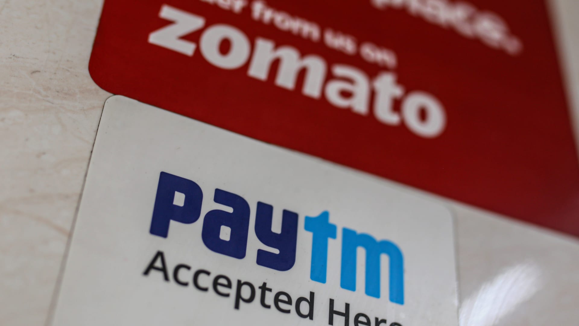 A store advertises the use of the Paytm digital payment system and the Zomato food delivery app in Mumbai, India, on Saturday, July 17, 2021.