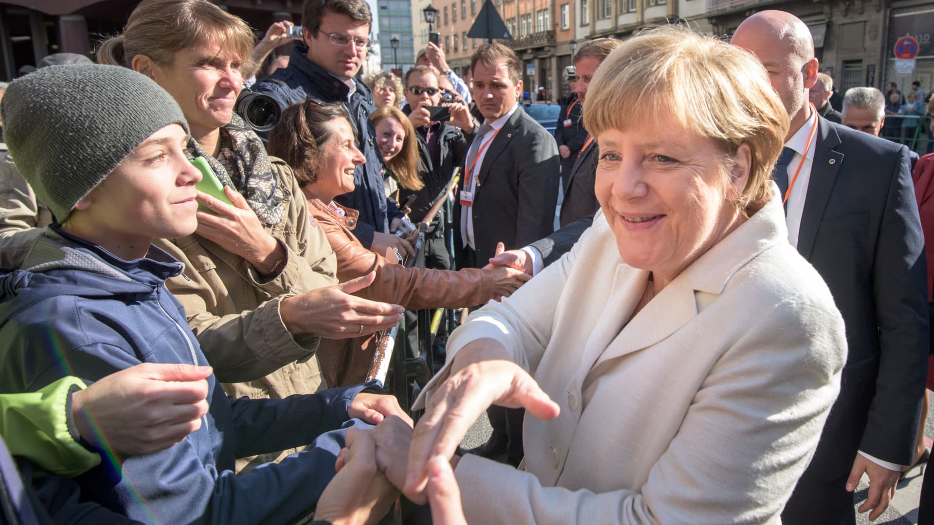 Outgoing German Chancellor Angela Merkel greets the crowds in Frankfurt, Germany.