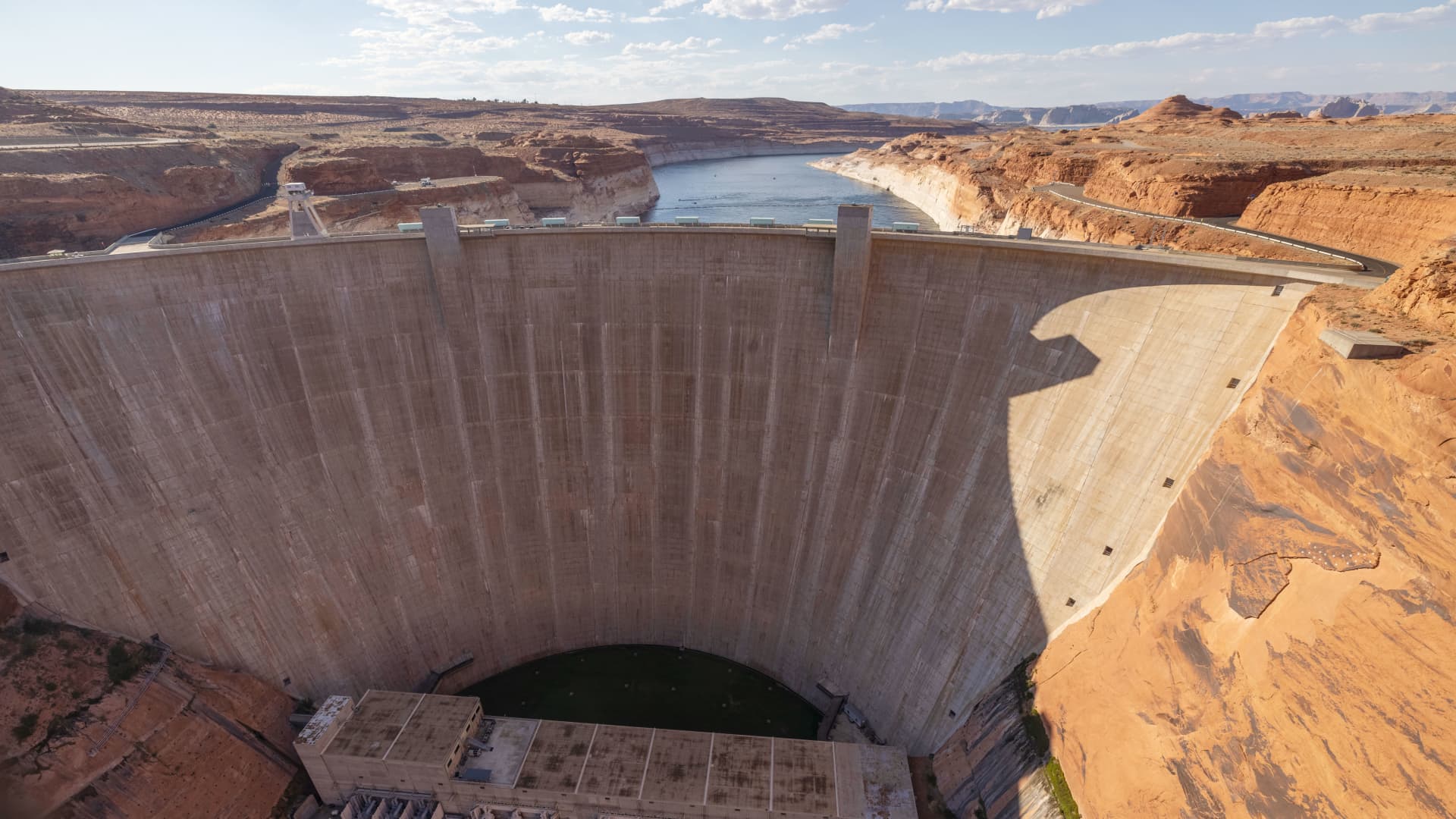 Glen Canyon Dam is seen, behind which are record low water levels at Lake Powell, as the drought continues to worsen on July 2, 2021 near Page, Arizona.