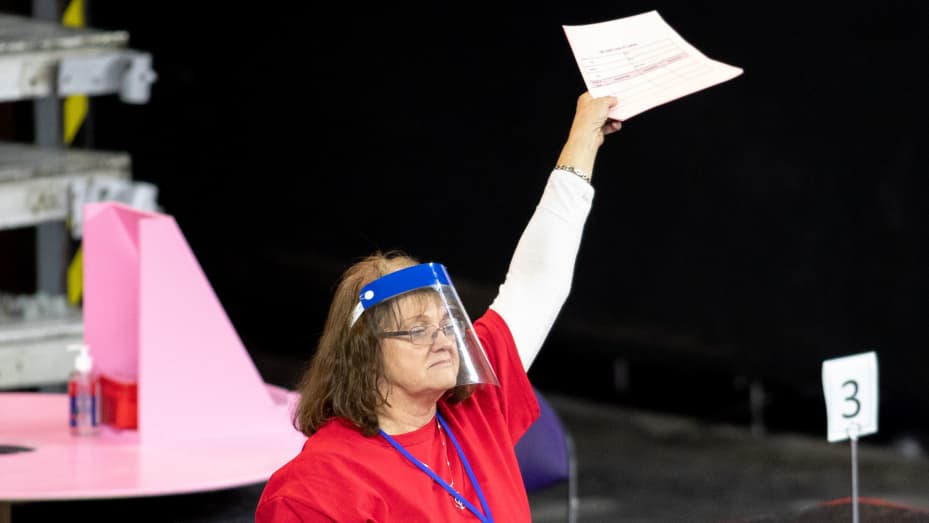 A contractor working for Cyber Ninjas, who was hired by the Arizona State Senate, works to recount ballots from the 2020 general election at Veterans Memorial Coliseum on May 1, 2021 in Phoenix, Arizona.
