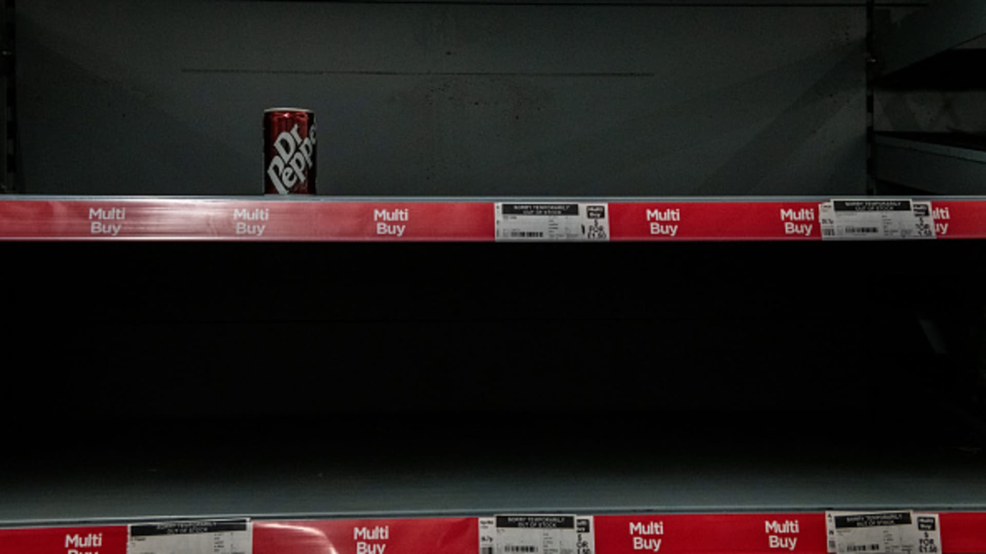 One remaining drink is seen on a near-empty shelf at an Asda supermarket in London, England on September 19, 2021.