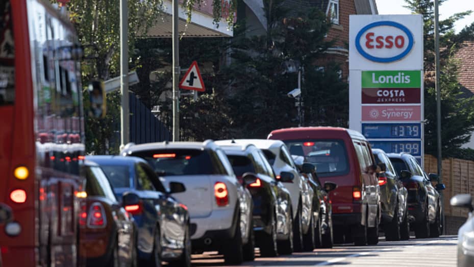 A queue forms for an Esso petrol station on September 24, 2021 in London.