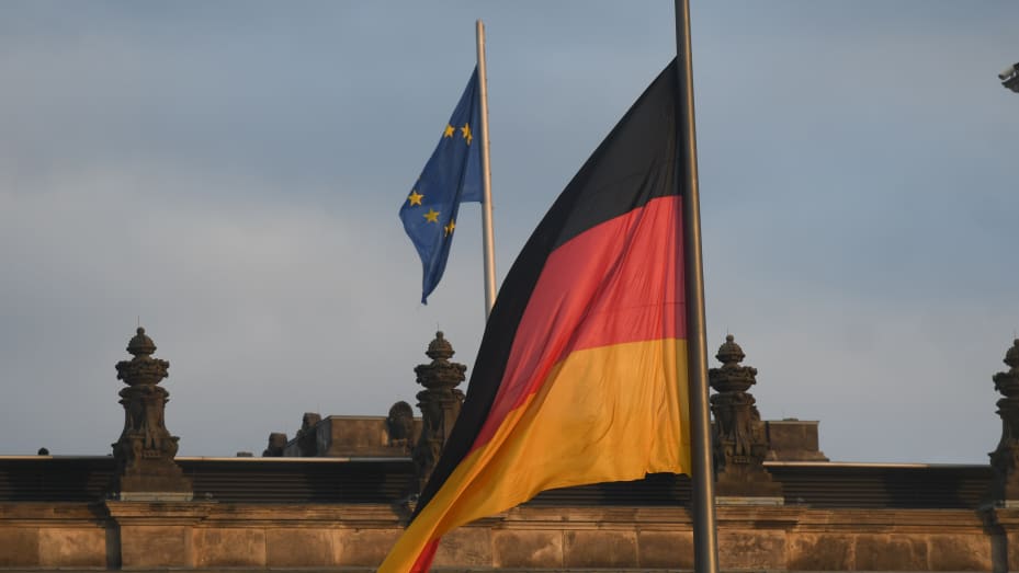 A view of EU and German flags over the Reichstag building, the seat of the German Parliament.