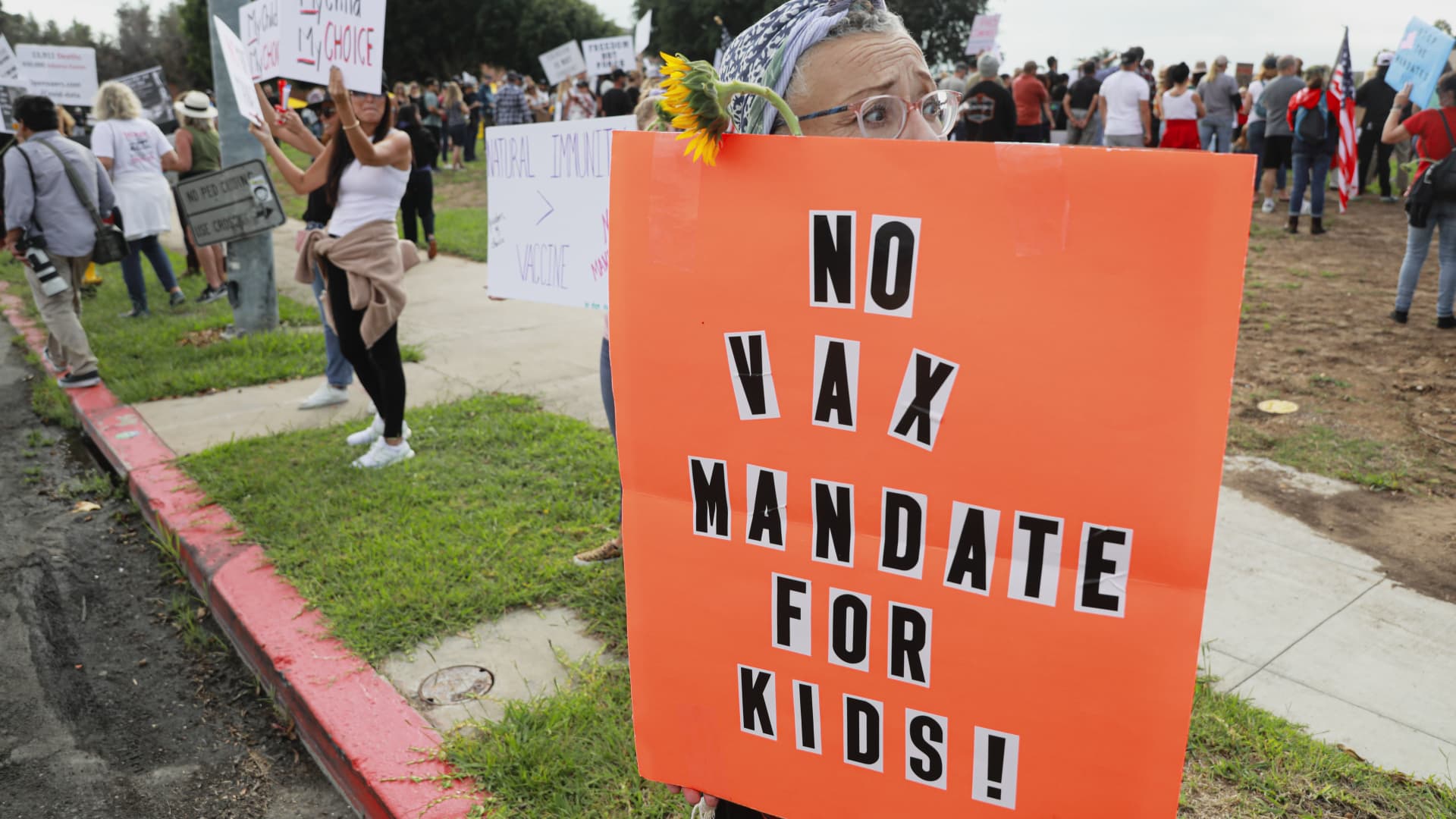 Anti-vaccine protesters stage a protest outside of the San Diego Unified School District office to protest a forced vaccination mandate for students on September 28, 2021 in San Diego, California.