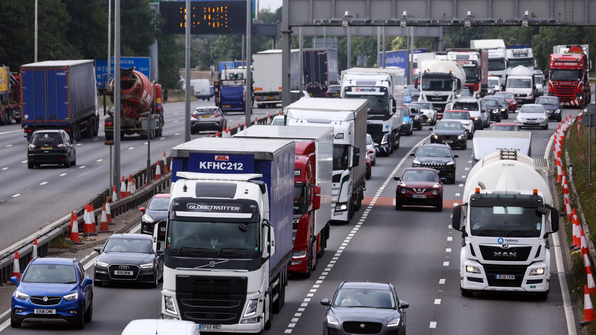 Trucks and automobiles approach the Dartford tunnel in the U.K. on Sept. 3, 2021.