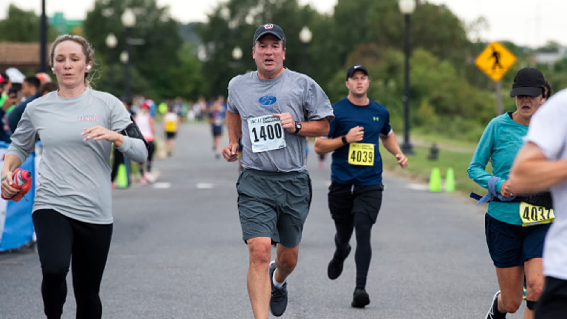 Supreme Court Justice Brett Kavanaugh crosses the finish line during the ACLI Capital Challenge 3 Mile Team Race in Anacostia Park on Wednesday, September 29, 2021.