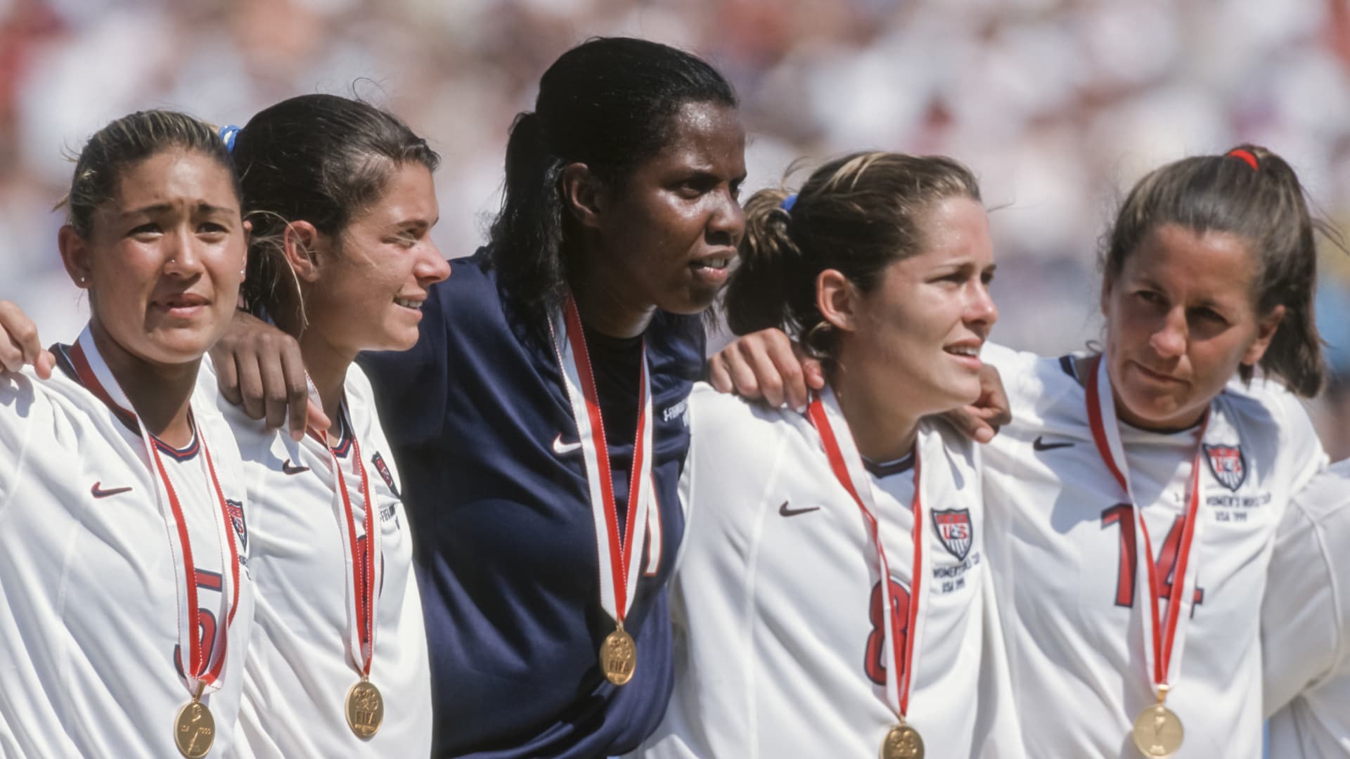 PASADENA, CA - JULY 10: Tiffany Roberts #5, Mia Hamm #9, Briana Scurry #1, Shannon MacMillan #8, and Joy Fawcett #14 of the USA celebrate winning the 1999 FIFA Women's World Cup final played against China on July 10, 1999 at the Rose Bowl in Pasadena, California.