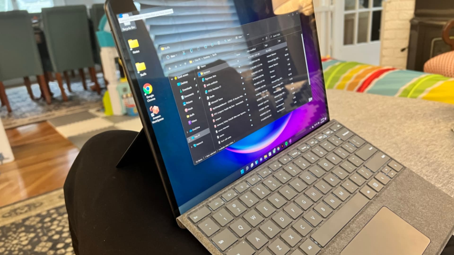 Balancing the Surface Pro 8 on my lap.