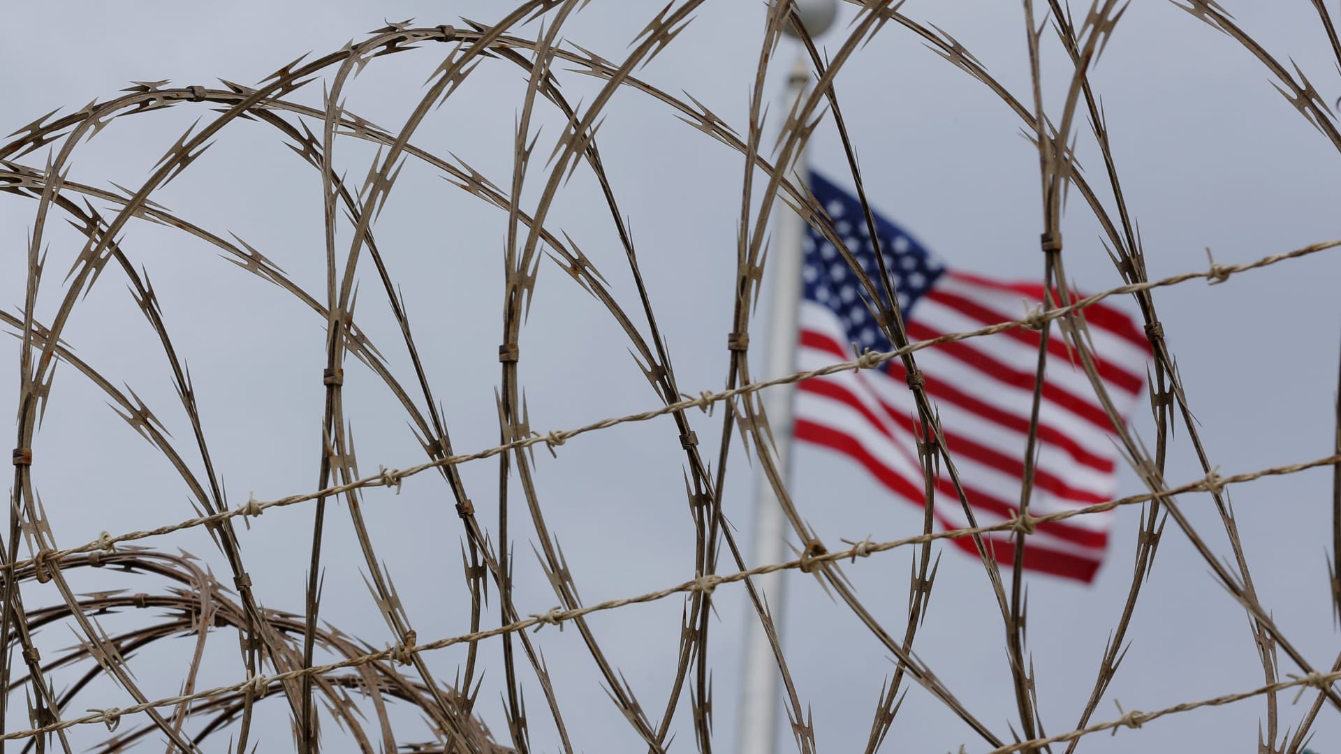 The United States flag flies inside of Joint Task Force Guantanamo Camp VI at the U.S. naval base in Guantanamo Bay, Cuba, March 22, 2016.