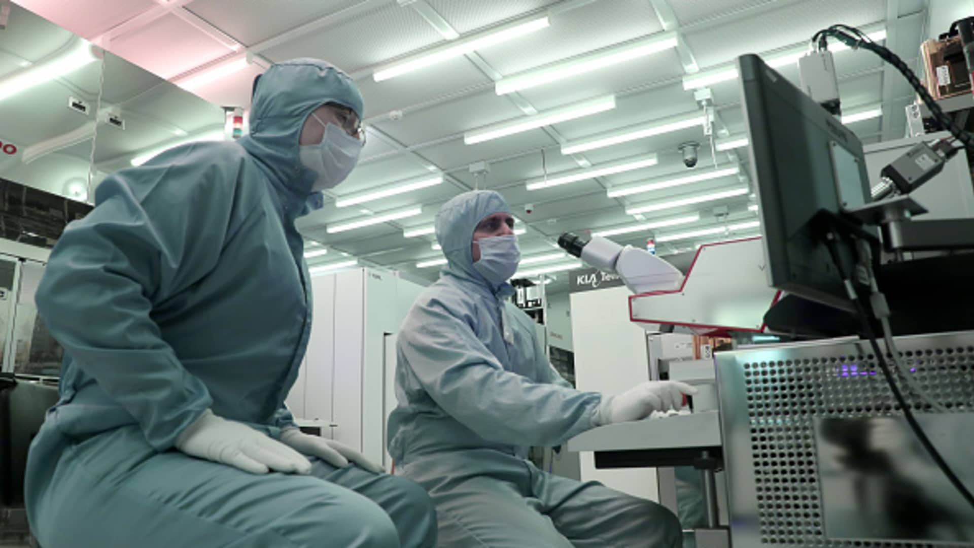 Employees at Russia's Mikron plant manufacturing microchips for electronic passports.