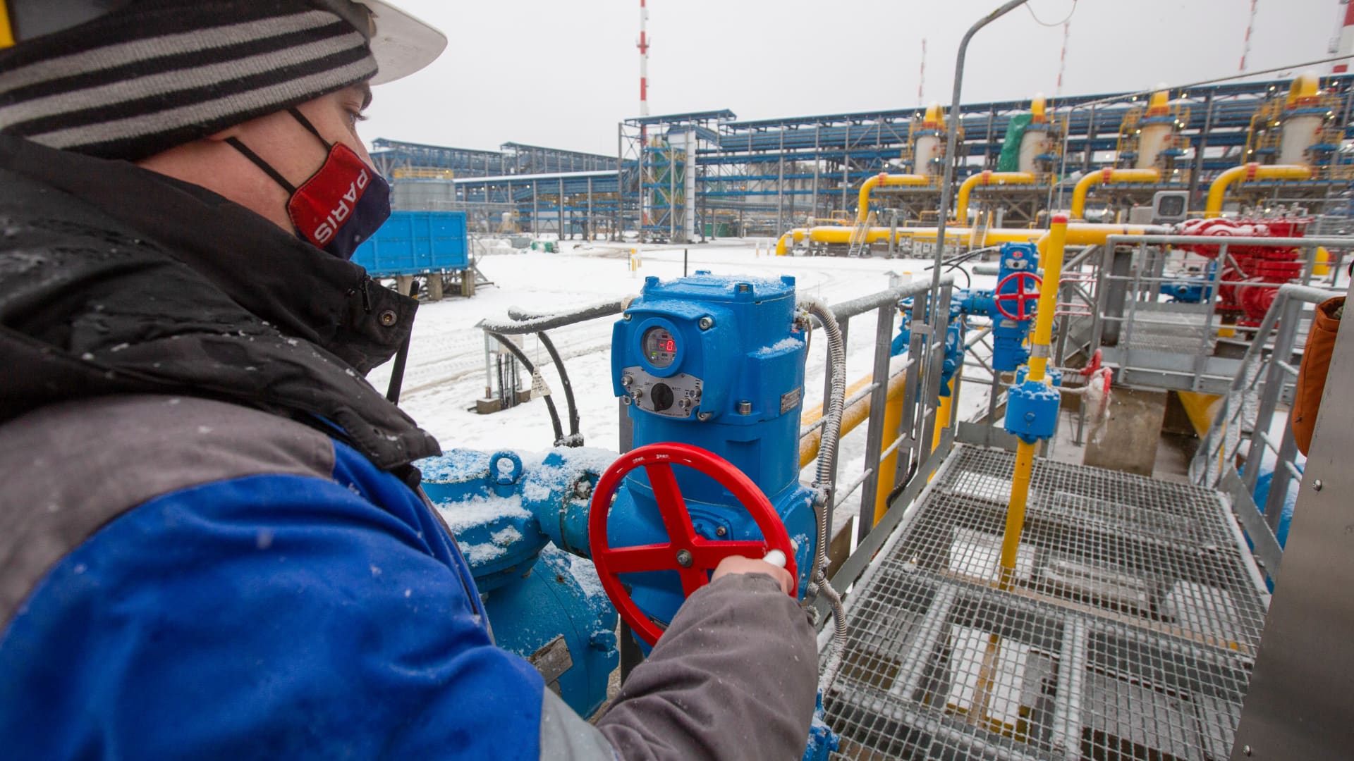 A worker adjusts a pipeline valve at the Gazprom PJSC Slavyanskaya compressor station, the starting point of the Nord Stream 2 gas pipeline, in Ust-Luga, Russia, on Thursday, Jan. 28, 2021.