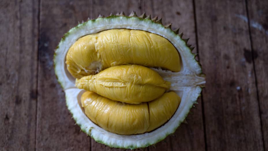 A durian's soft, yellow flesh inside its thorny green husk seen at a shop in Kuala Lumpur, Malaysia.