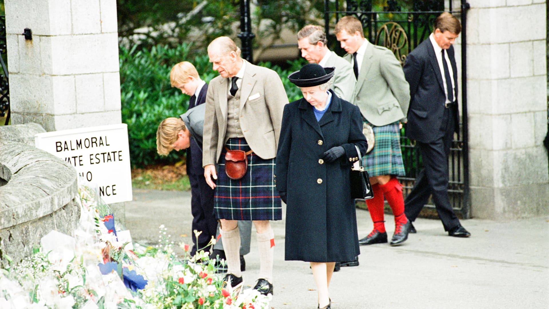 Royal Family, Balmoral Estate, Scotland, 5th September 1997. After attending a private service at Crathie Church, Royal family stop to look at floral tributes left for Princess Diana, at the gates of Balmoral Castle. They are: Queen Elizabeth II, Prince Philip, Prince Charles, Prince William, Prince Harry, Peter Phillips.
