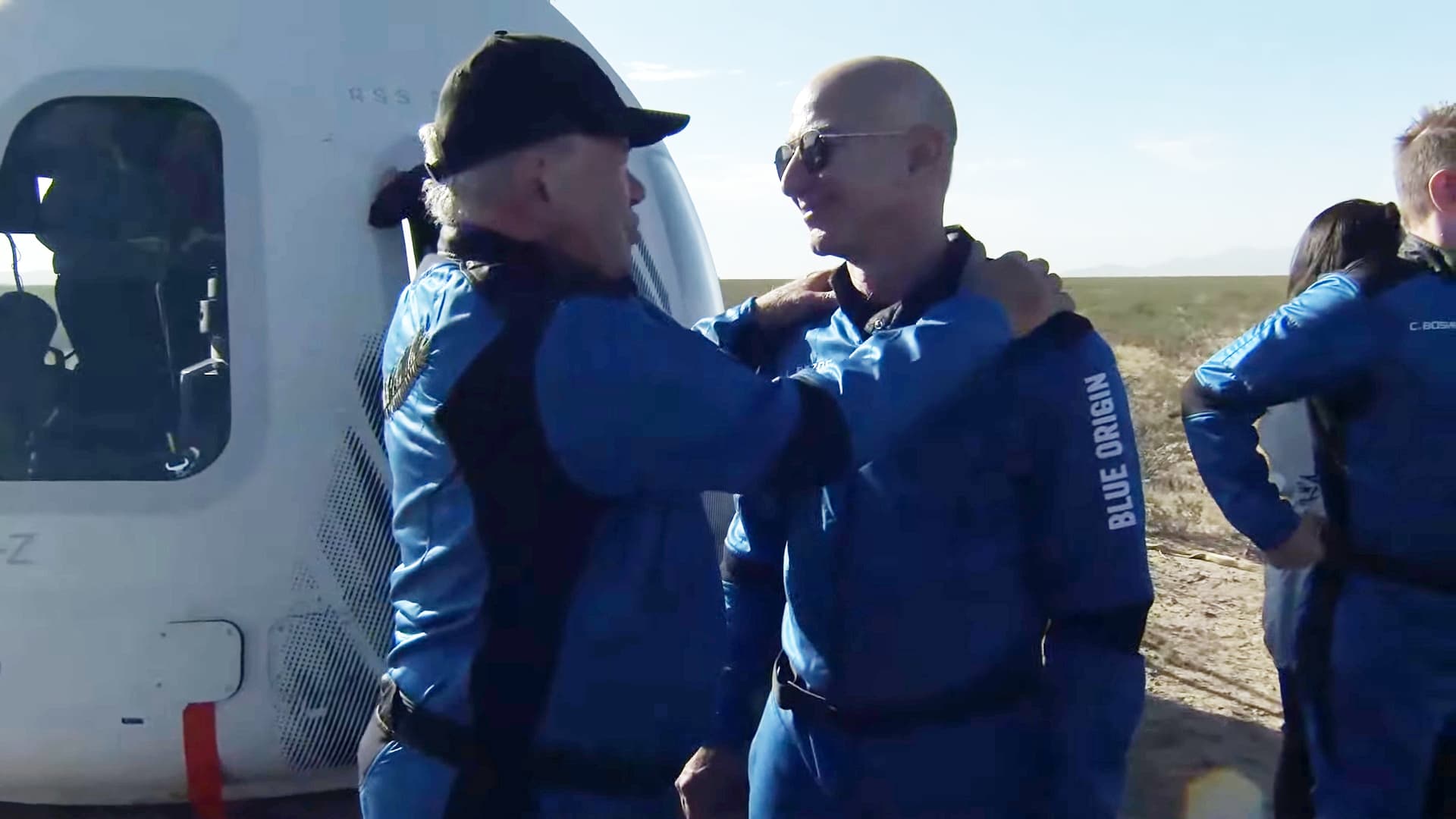 A screenshot taken from a live handout video on October 13, 2021 shows Jeff Bezos talks to William Shatner after Blue Origin's New Shepard crew capsule landed back in Texas, the United States.