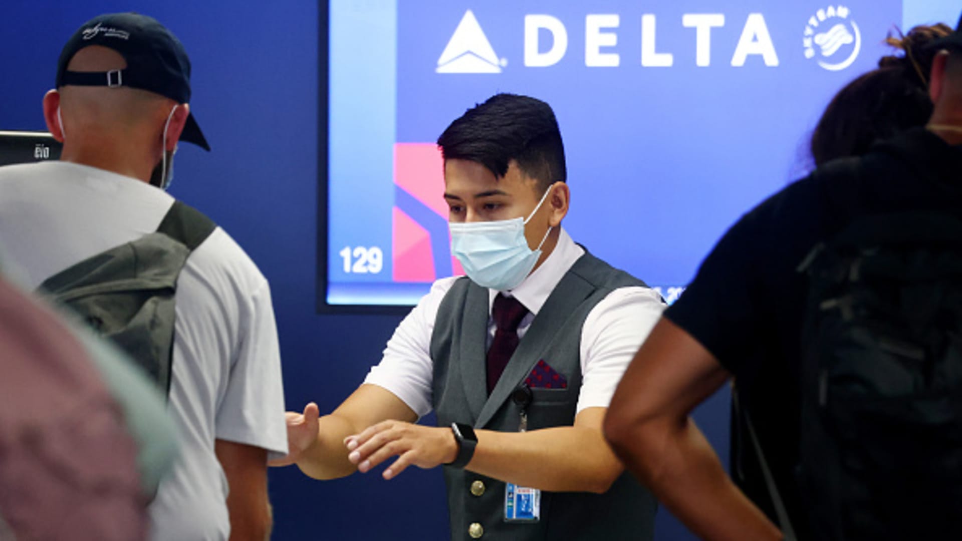 A Delta Air Lines employee works on the departures level at Los Angeles International Airport (LAX) on August 25, 2021 in Los Angeles, California.