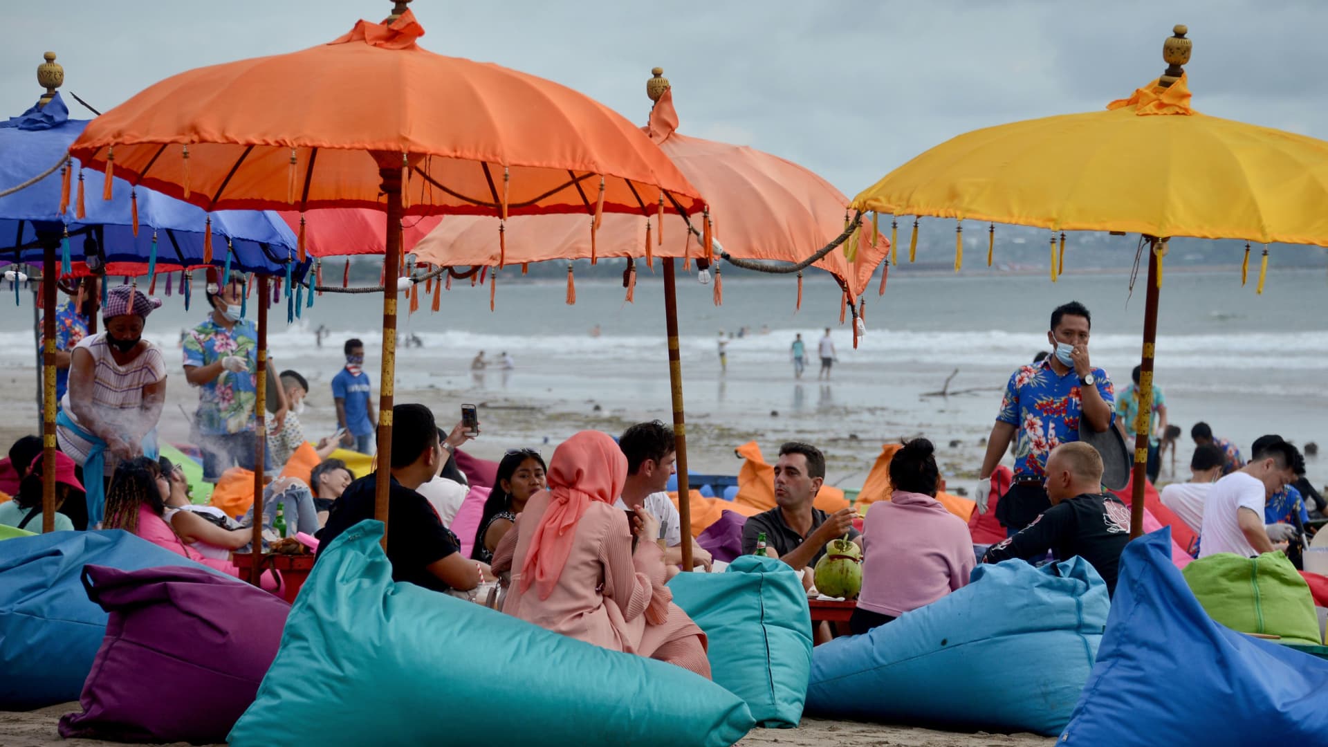 People visit Seminyak on Indonesia's holiday island of Bali on Jan. 5, 2021.