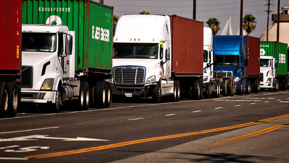 As far as the eye can see cargo trucks wait in long lines to enter The Port of Los Angeles as the port is set to begin operating around the clock on Wednesday, Oct. 13, 2021 in San Pedro, CA.