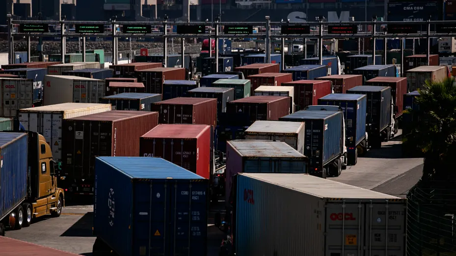A sea of cargo trucks wait in long lines to enter The Port of Los Angeles as the port is set to begin operating around the clock on Wednesday, Oct. 13, 2021 in San Pedro, CA.