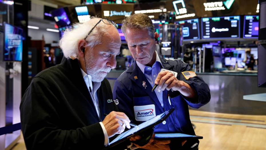 Traders work on the floor of the New York Stock Exchange (NYSE) in New York City, U.S., October 20, 2021.