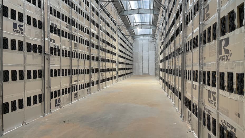 A "hot aisle" in Riot's Whinstone bitcoin mine, where temperatures can hit 150 degrees thanks to the heat created by mining rigs.