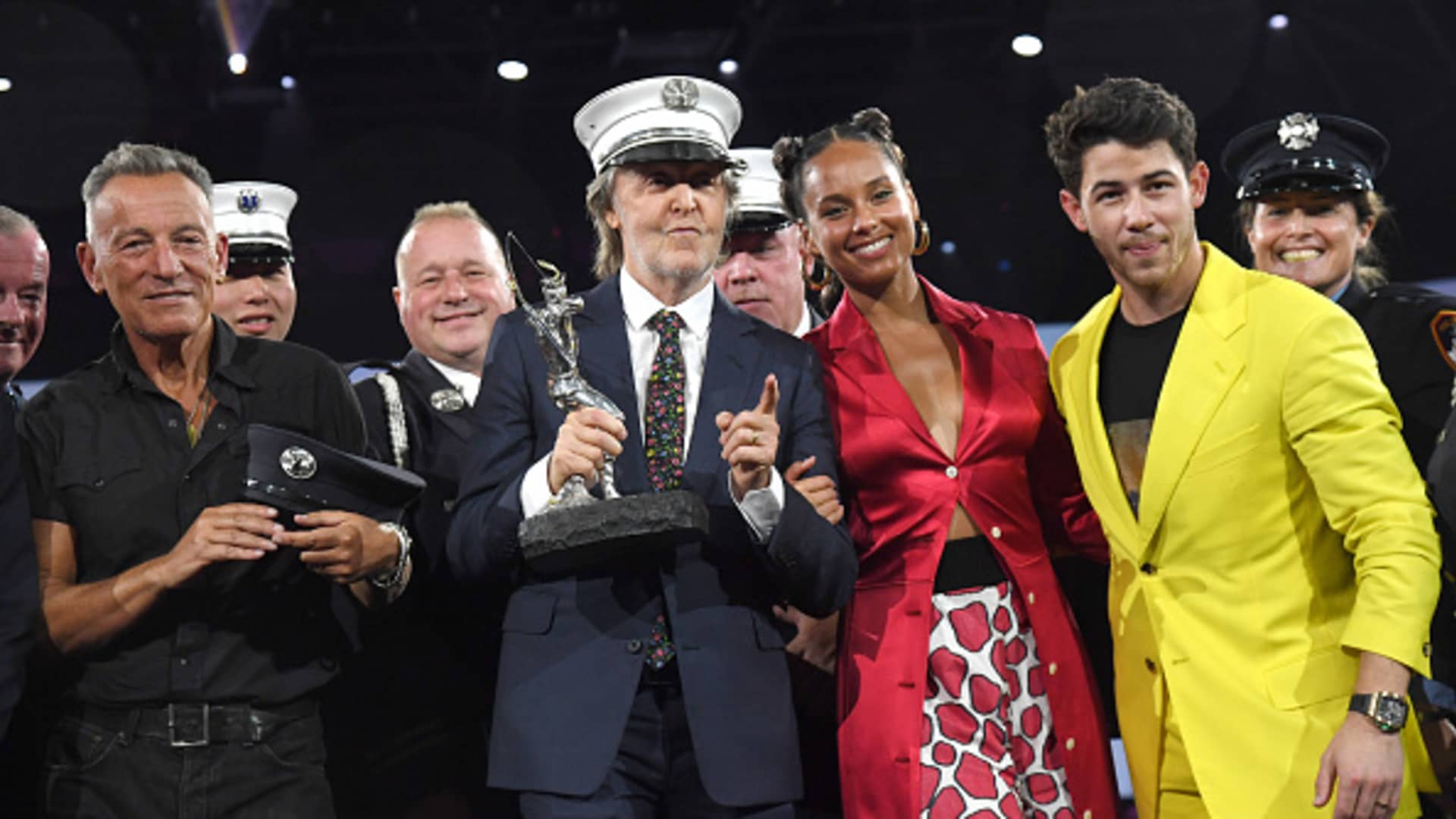 Bruce Springsteen, Paul McCartney, Alicia Keys and Nick Jonas pose onstage during the Robin Hood Benefit at Jacob Javits Center on October 20, 2021 in New York City.