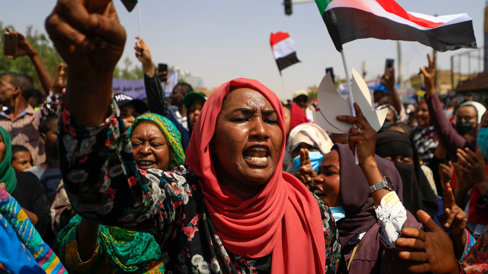 KHARTOUM, Sudan - Sudanese demonstrators take to the streets of the capital Khartoum to demand the government's transition to civilian rule, on October 21, 2021.