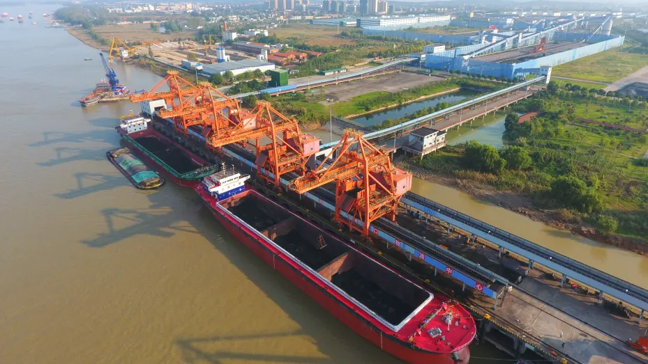 This photo taken on October 24, 2021 shows coal being loaded on a cargo ship in Jiujiang, in China's central Jiangxi province.