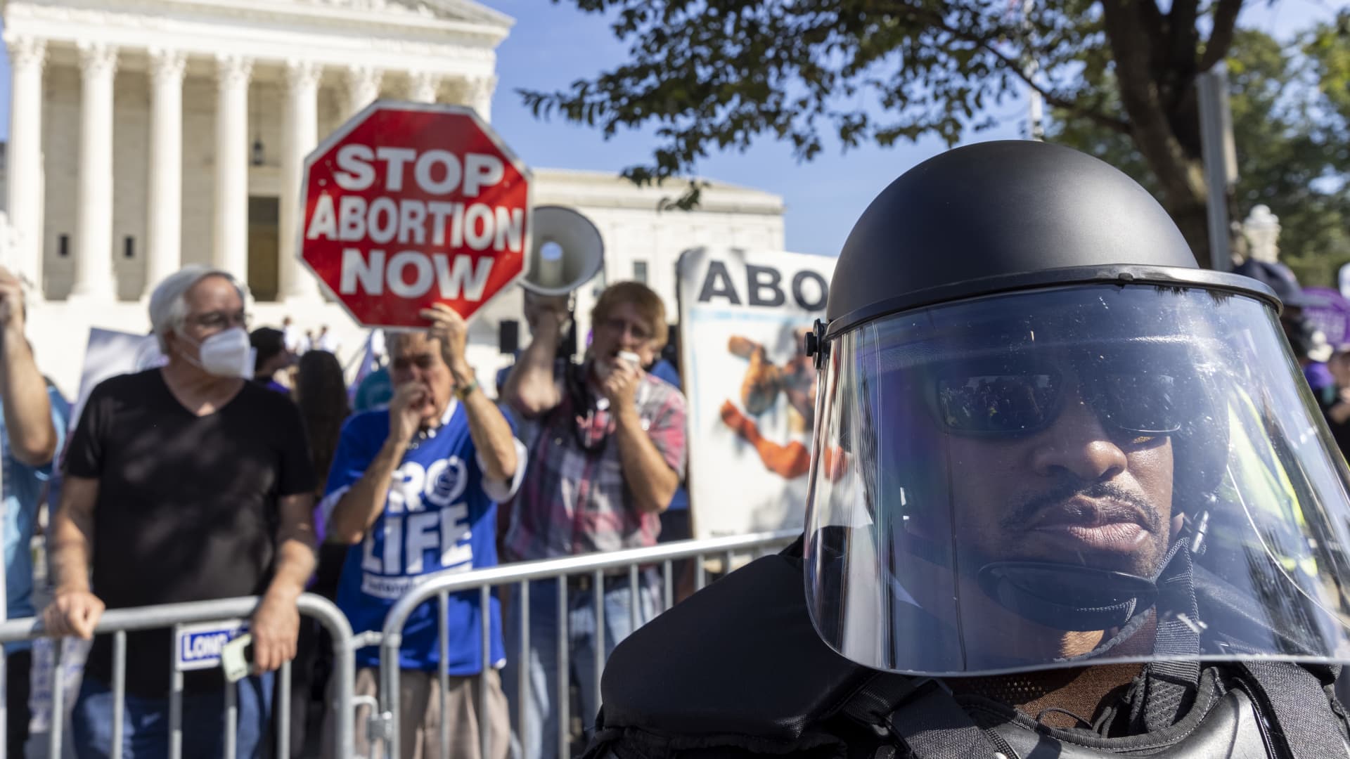 United States Capitol Police in riot gear stand between Women rights activists and anti-abortion activist, as they gather in front of the supreme court after a rally at freedom plaza for the annual Women’s March October 2, 2021 in Washington, DC.