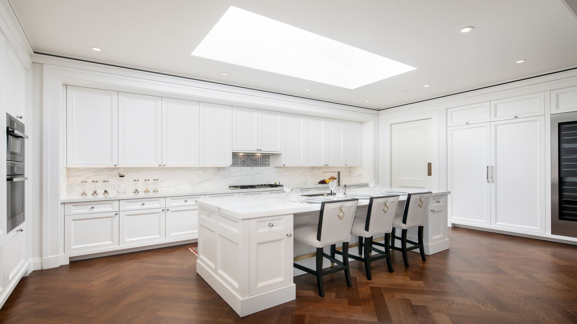 The open kitchen, with marble countertops and luxury appliances