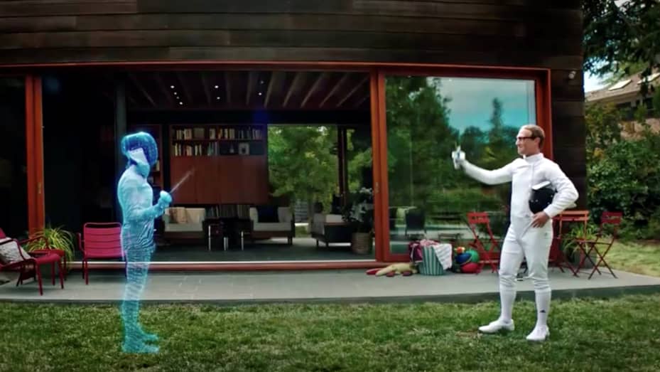 Facebook CEO Mark Zuckerberg is seen fencing in the "Metaverse" with an Olympic gold medal fencer during a live-streamed virtual and augmented reality conference to announce the rebrand of Facebook as Meta, in this screen grab taken from a video released 