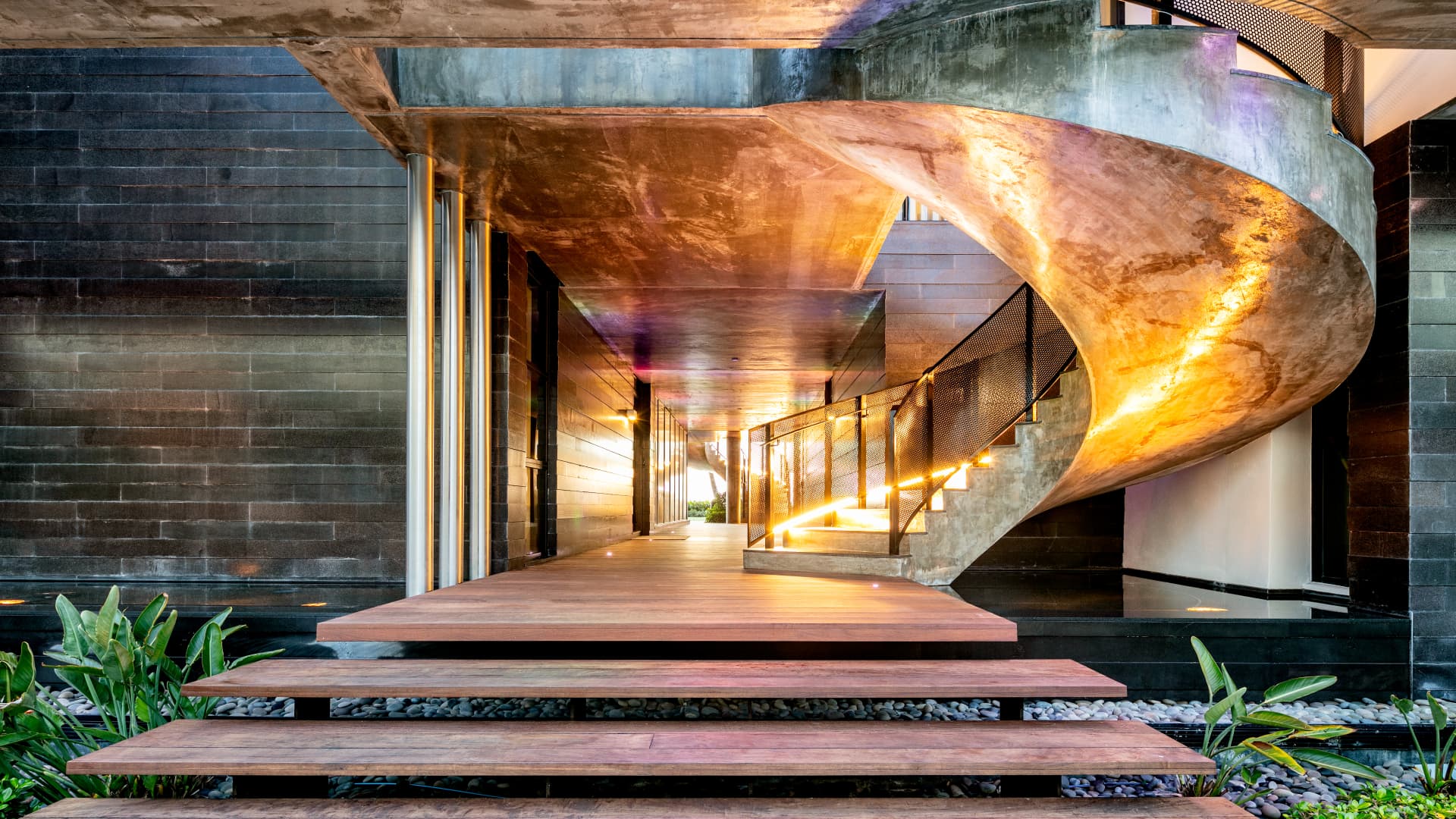 One of the home's two spriral staircases built of polished concrete leading to the homes second level 17 ft above sea level.