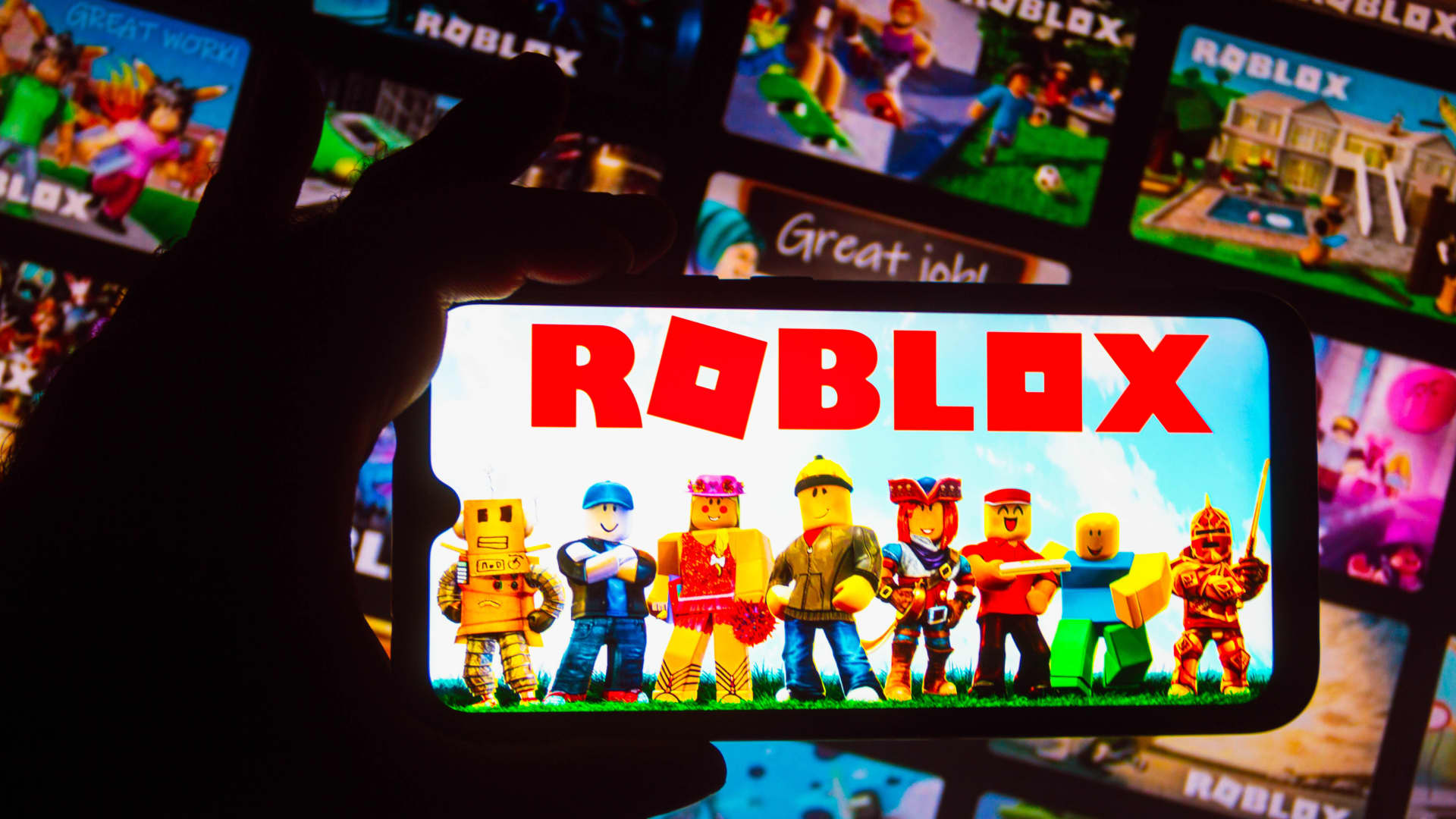 The Roblox logo displayed on a smartphone.