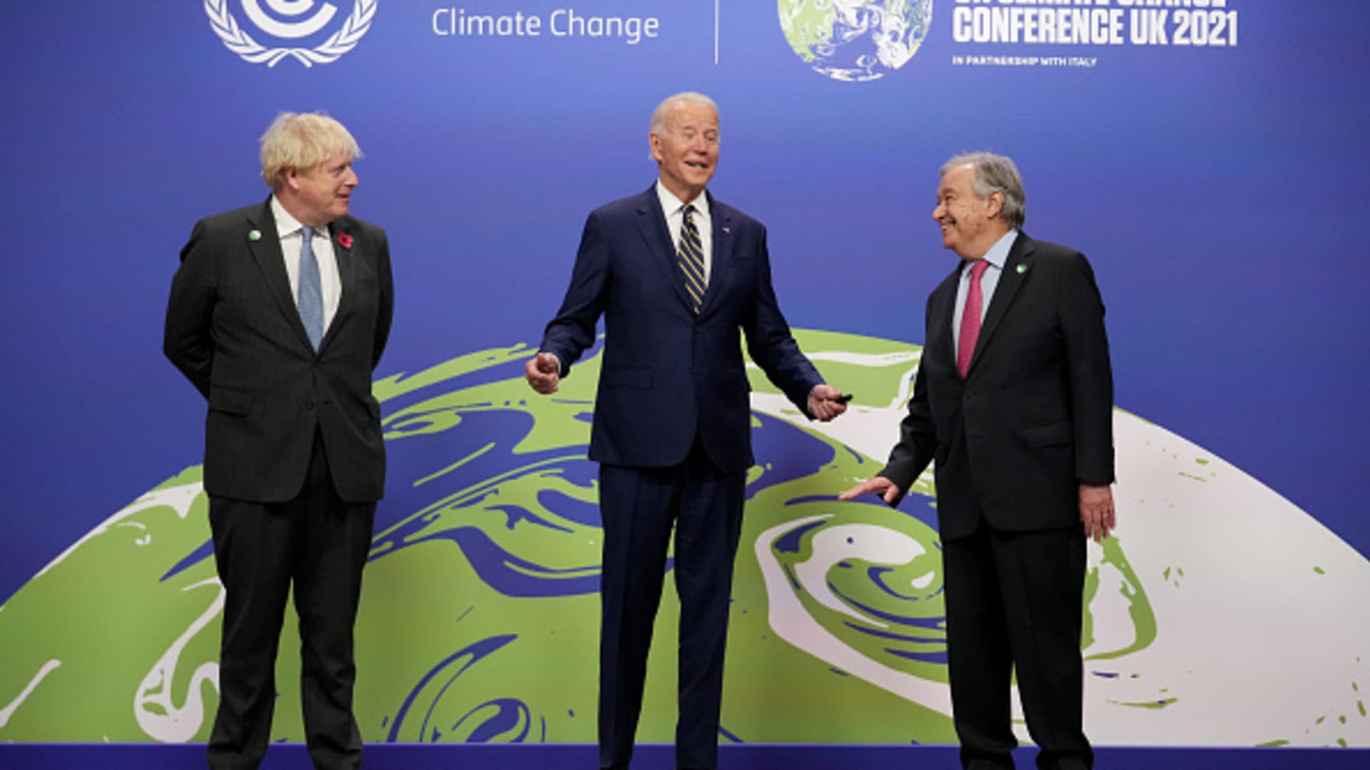 British Prime Minister Boris Johnson and U.N. Secretary General Antonio Guterres greet U.S. President Joe Biden as they arrive for day two of COP26 on November 1, 2021.