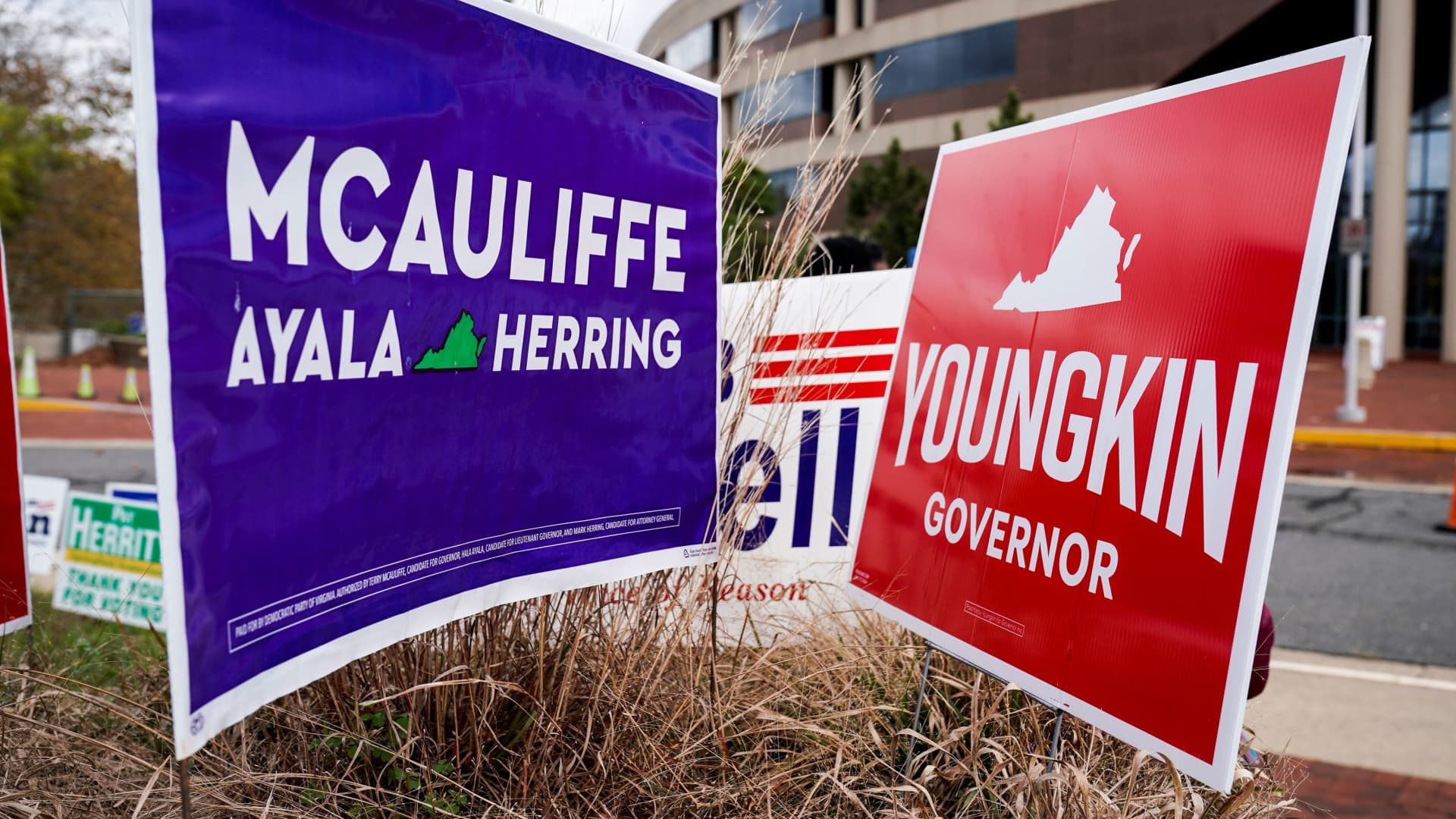 Campaign signs for Democrat Terry McAuliffe and Republican Glenn Youngkin stand together on the last day of early voting in the Virginia gubernatorial election in Fairfax, Virginia, U.S., October 30, 2021.