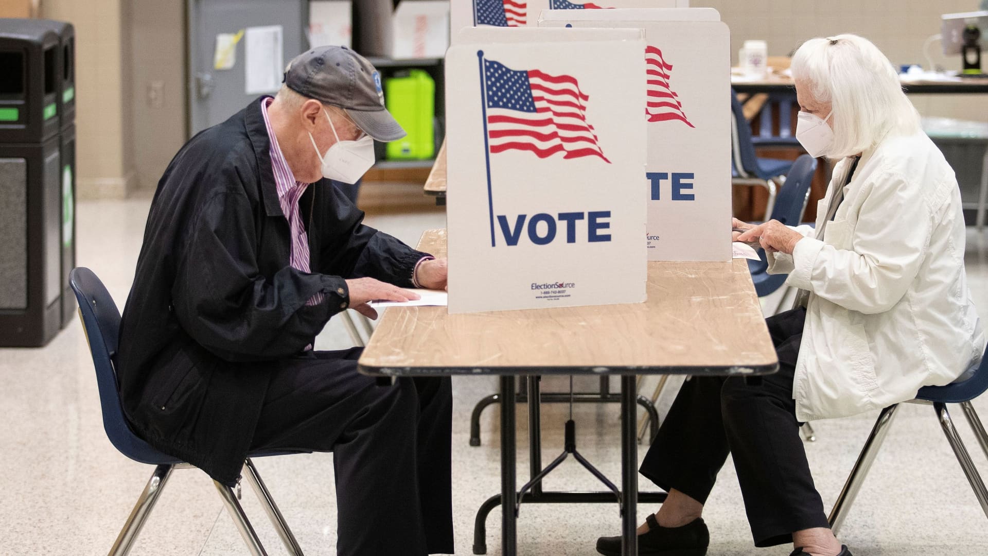 Former Associate Justice of the Supreme Court of the U.S. Anthony Kennedy and his wife, Mary Davis, cast their votes during the Virginia governor's race, at Langley High School in McLean, Virginia, on Nov. 2, 2021.