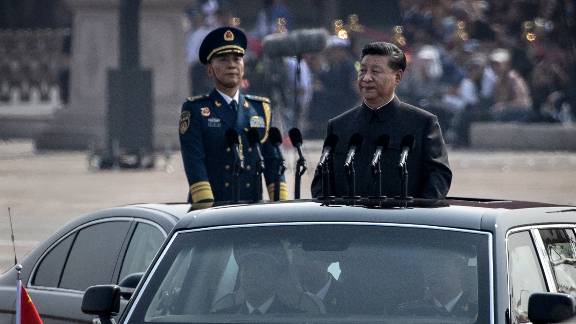 Chinese President Xi Jinping drives in a Hong Qi car after inspecting the troops during a parade to celebrate the 70th Anniversary of the founding of the People's Republic of China at Tiananmen Square in 1949, on October 1, 2019 in Beijing, China.
