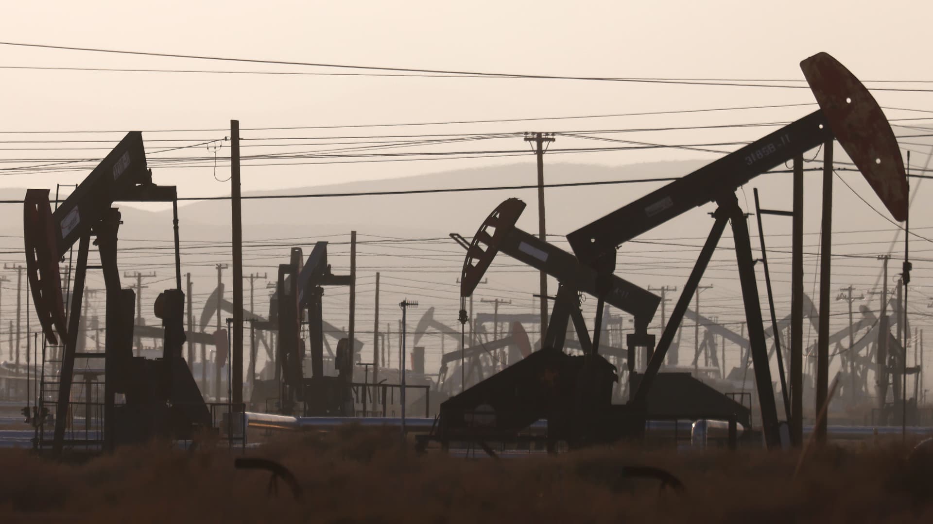Some pumpjacks operate while others stand idle in the Belridge oil field near McKittrick, California. Oil prices rose in early Asian trade on the prospect that a stalled Iran nuclear deal and Moscow's new mobilization campaign would restrict global supplies.