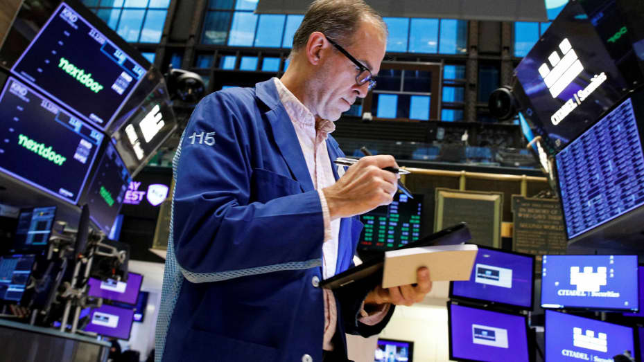 A trader works on the floor of the New York Stock Exchange (NYSE) November 8, 2021.