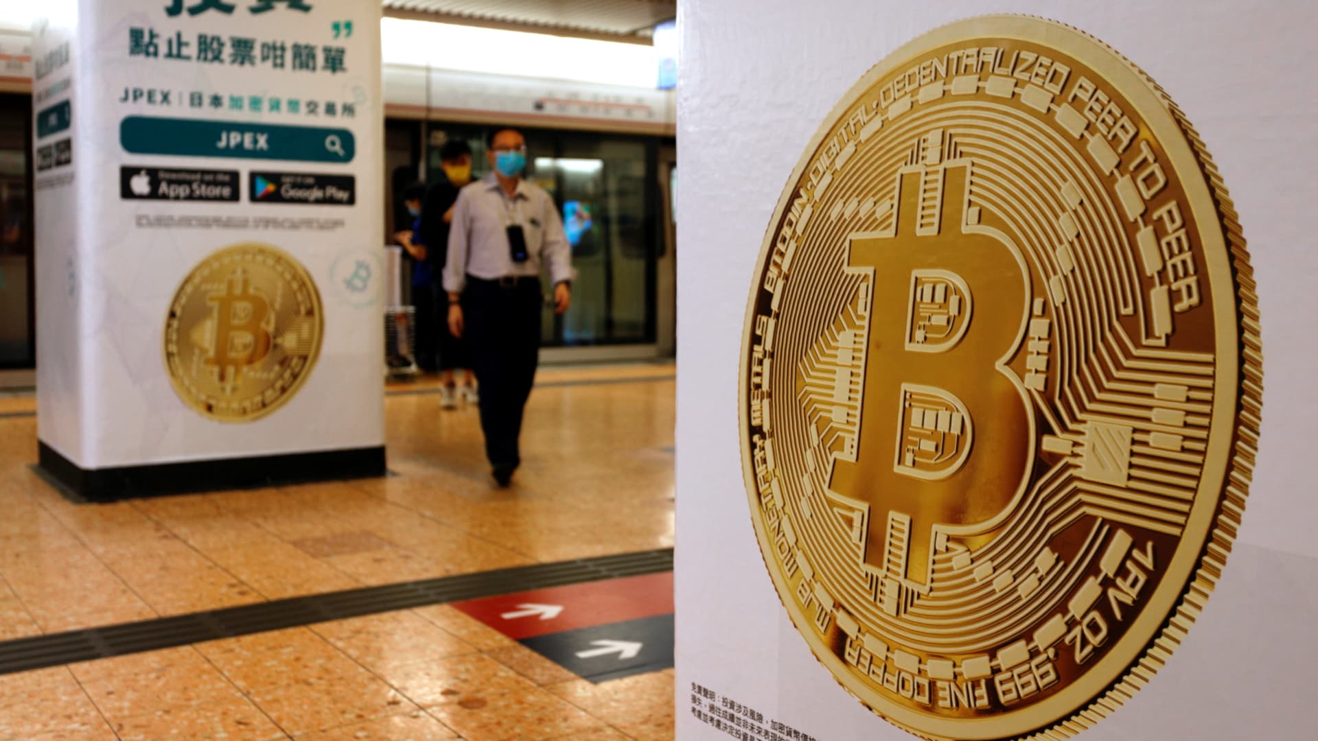 A Bitcoin symbol on an advertisement at Mass Transit Railway station in Hong Kong, China, on Oct. 27, 2021.