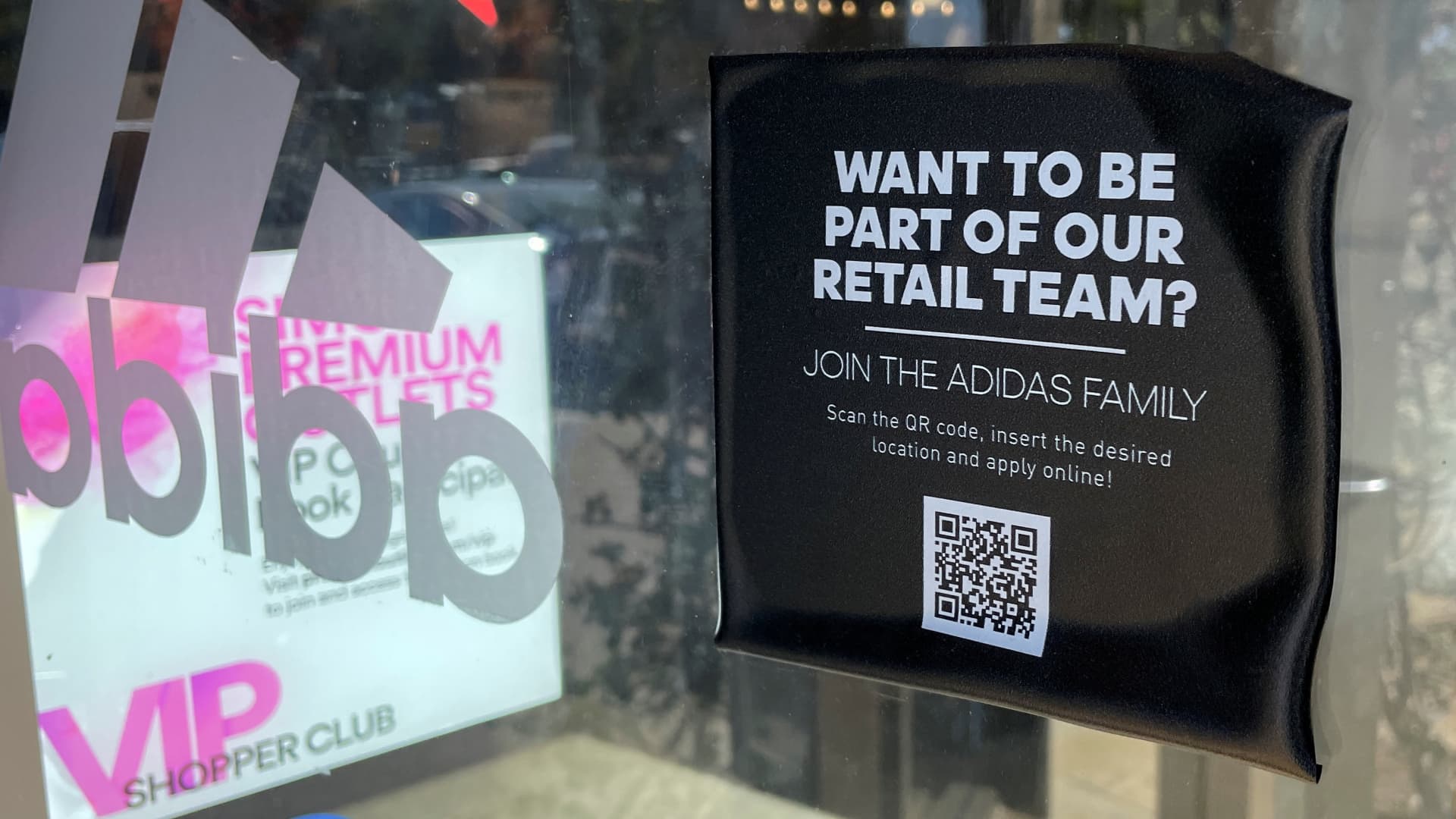 A job posting is shown on the window of a retail store looking for seasonal workers at a shopping mall in Carlsbad, California, November, 9, 2021.