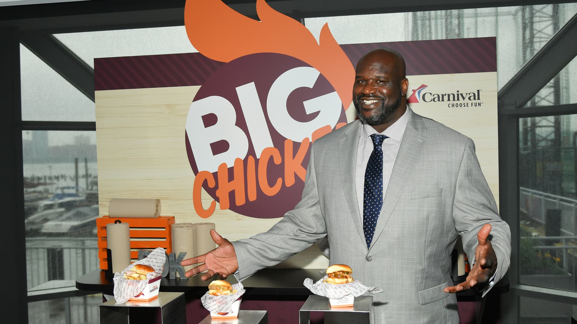 Shaquille O'Neal, NBA star and Carnival Cruise Line’s Chief Fun Officer, gives guests a taste of his highly-anticipated dishes that will be offered at sea as part of Big Chicken at Mardi Gras’ Summer Landing zone during Carnival Cruise Line's NYC Cruise Into Summer Event To Celebrate The Arrival Of Mardi Gras In 2020 at Pier 59 on June 18, 2019 in New York City.