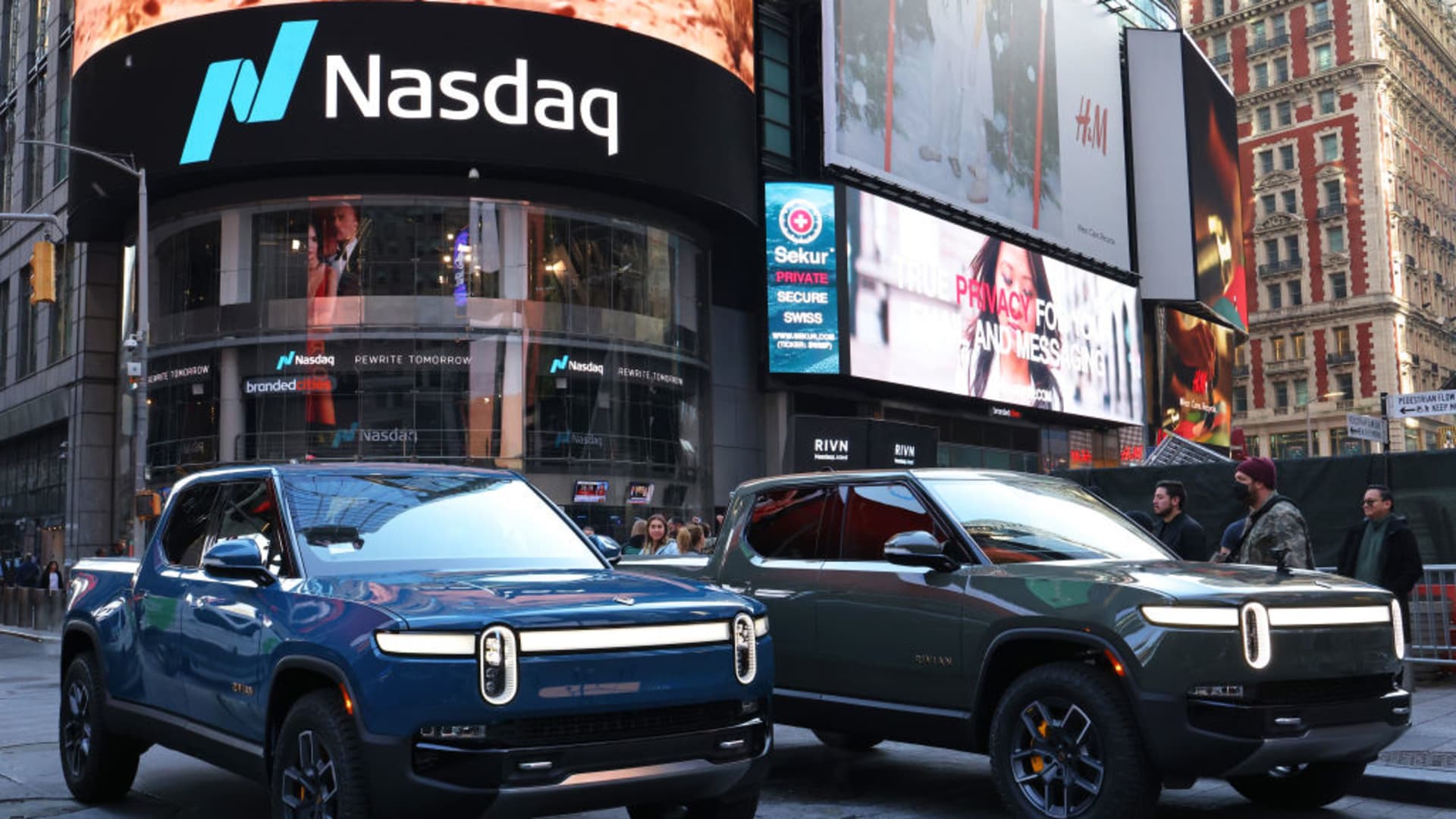 Rivian electric trucks are seen parked near the Nasdaq MarketSite building in Times Square on November 10, 2021 in New York City.