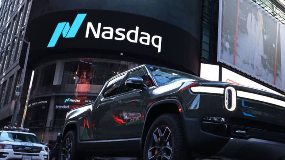 A Rivian electric truck is displayed near the Nasdaq MarketSite building in Times Square on November 10, 2021 in New York City.