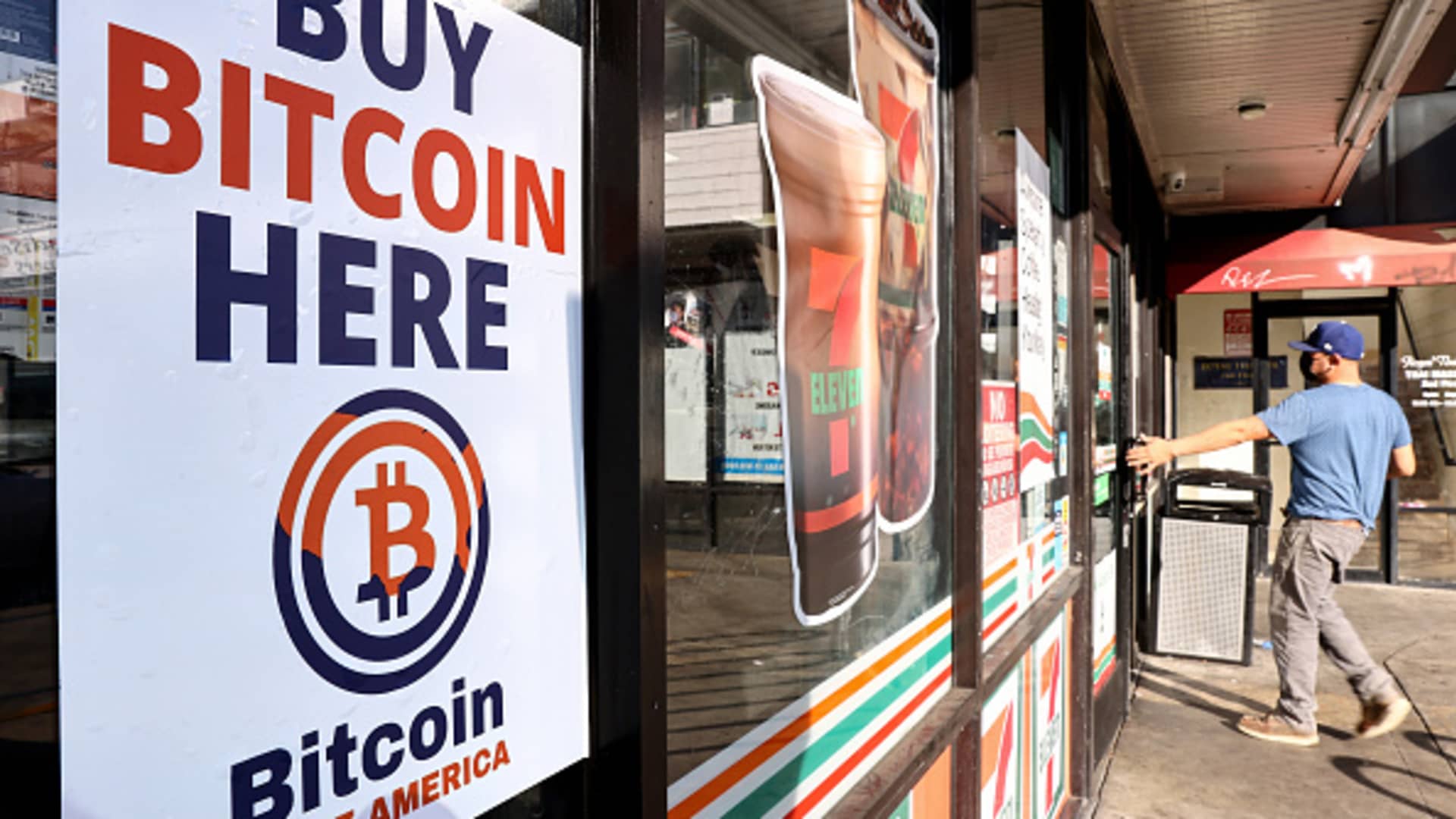 A 'Buy Bitcoin Here' sign is posted at a 7-Eleven store on November 10, 2021 in Los Angeles, California.